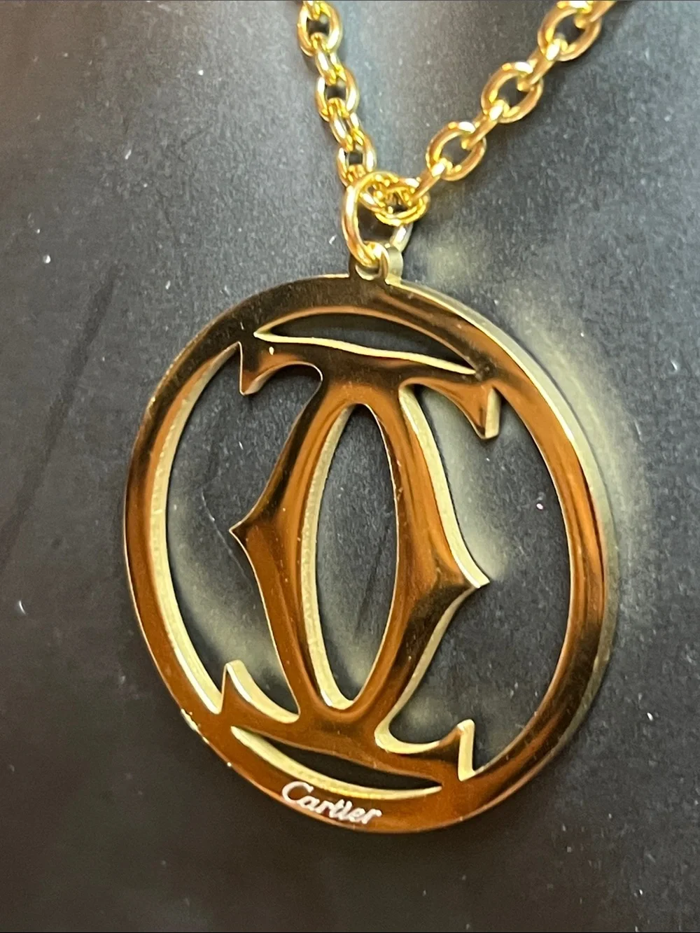 Gold and Black Circular Logo Pendant Necklace